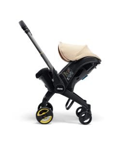 Doona I Infant Car Seat, Integrated Auto Adjust 5-Point Harness, Sleek And Ergonomic Design, Quick Release Wheels, Side Impact Protection - Sahara Sand