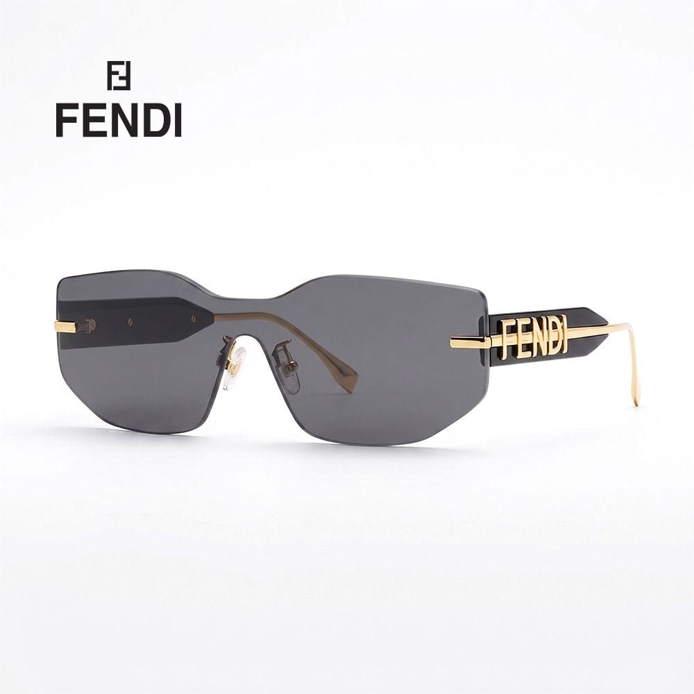 Fendi Unisex FE40066U Shield Sunglasses - Rimless Wraparound Design, Solid Grey UV Protection Lenses, Luxury Futuristic Designer Eyewear | Gold/Grey - 192337114472