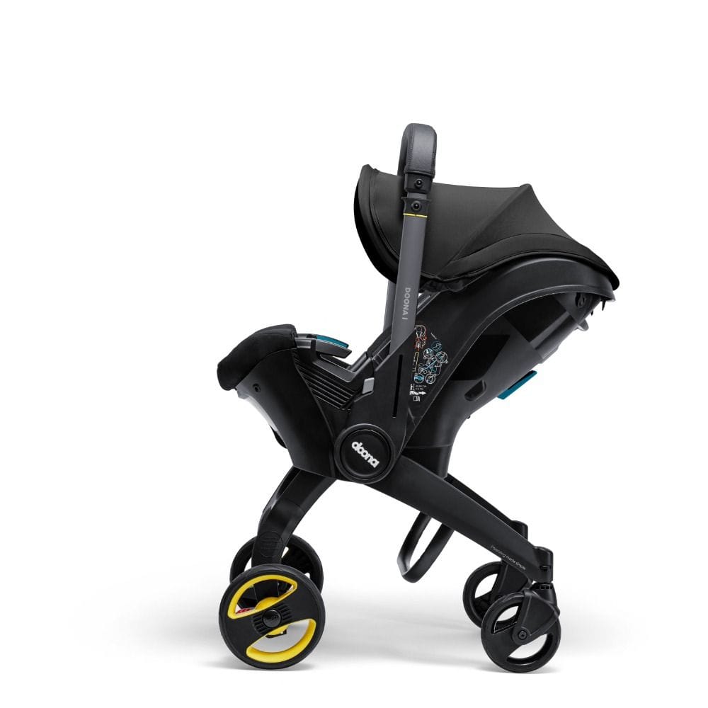 Doona I Infant Car Seat, Integrated Auto Adjust 5-Point Harness, Sleek And Ergonomic Design, Quick Release Wheels, Side Impact Protection - Nitro Black