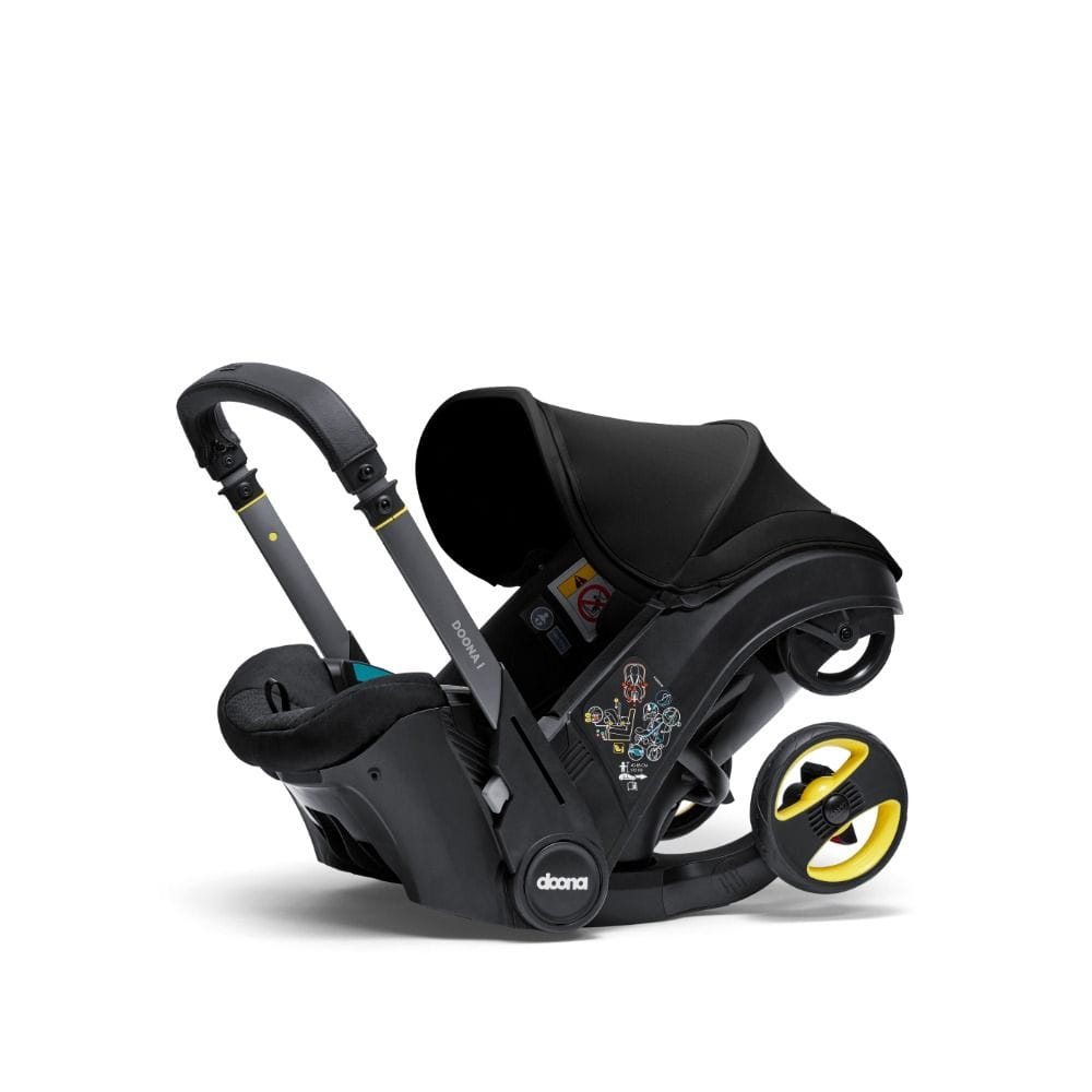 Doona I Infant Car Seat, Integrated Auto Adjust 5-Point Harness, Sleek And Ergonomic Design, Quick Release Wheels, Side Impact Protection - Nitro Black
