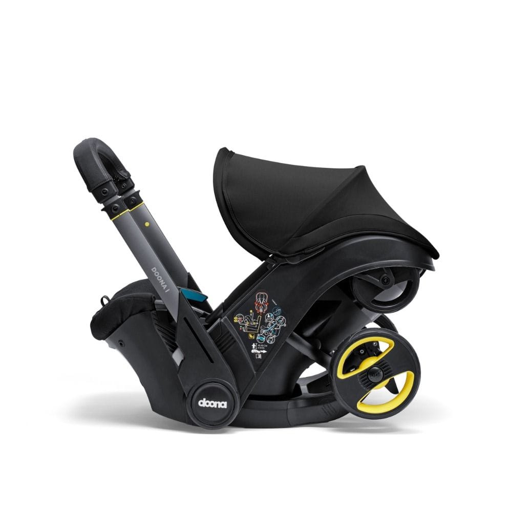 Doona I Infant Car Seat, Integrated Auto Adjust 5-Point Harness, Sleek And Ergonomic Design, Quick Release Wheels, Side Impact Protection - Nitro Black