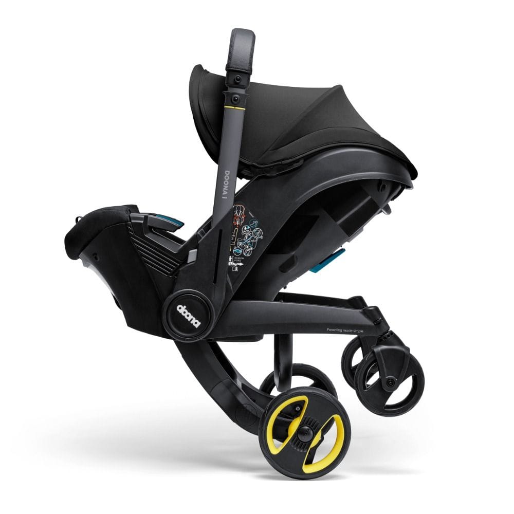 Doona I Infant Car Seat, Integrated Auto Adjust 5-Point Harness, Sleek And Ergonomic Design, Quick Release Wheels, Side Impact Protection - Nitro Black