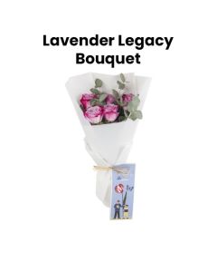A Hand Bouquet Of Purple Roses And Eucalyptus Leaves Wrapped With White Wrapping With Teacher's Day Card